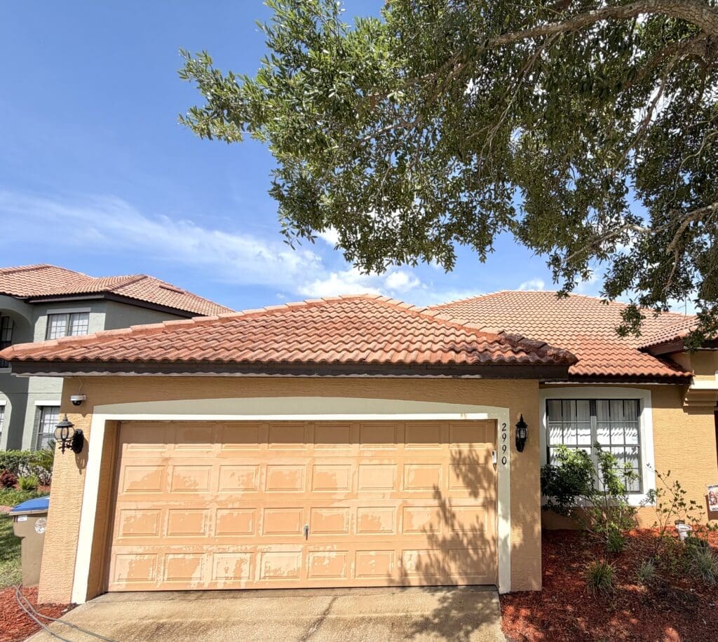 Home exterior and garage after pressure washing in Central Florida