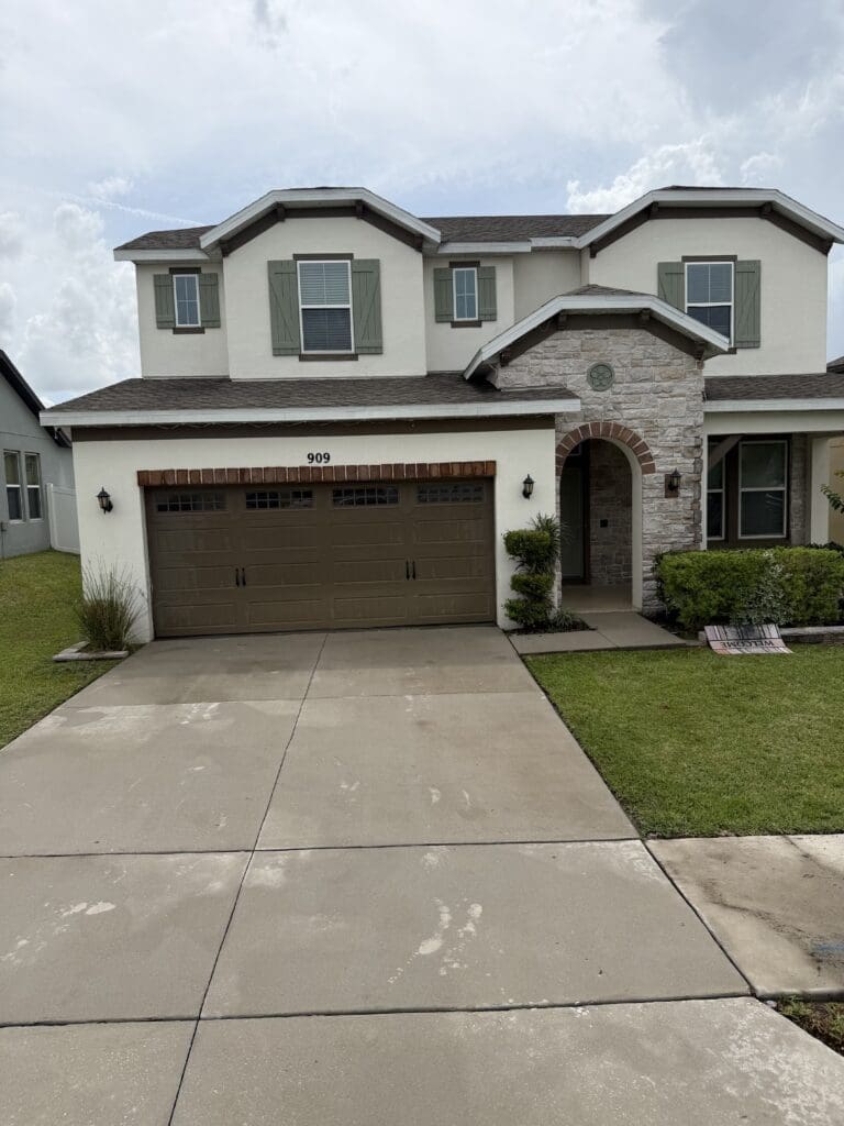 Two-story home exterior after house soft washing in Orlando FL