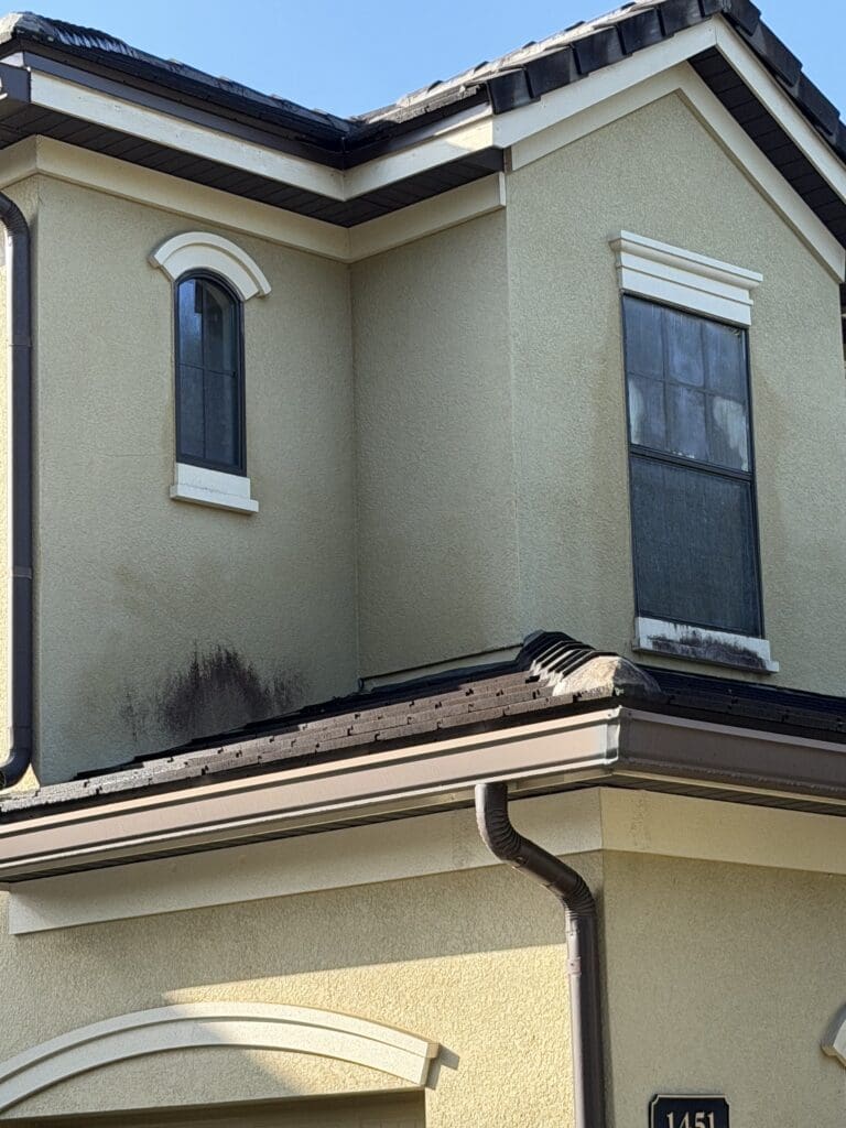 Two-story stucco home after house washing in Central Florida